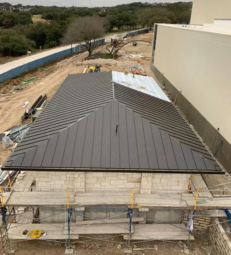 Metal roof new construction with scaffolding in Woodbury